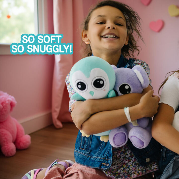 Girl snuggling penguin and koala PretziPals